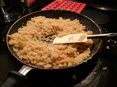 Breadcrumbs cooking with butter on stove